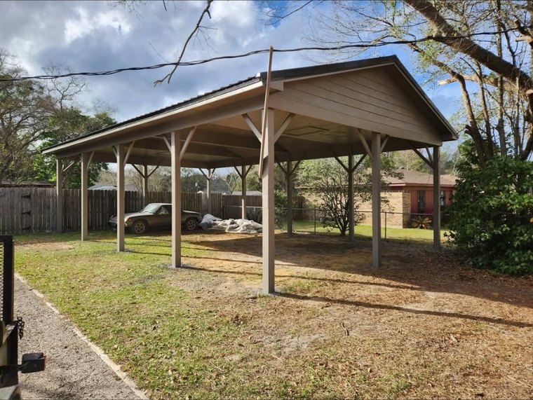 Free-standing carport with metal roof