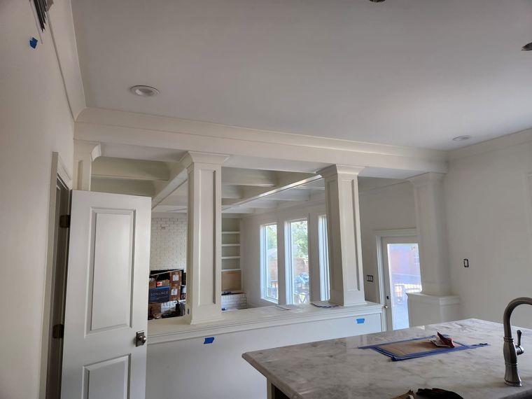 Kitchen remodel with custom column and beam millwork